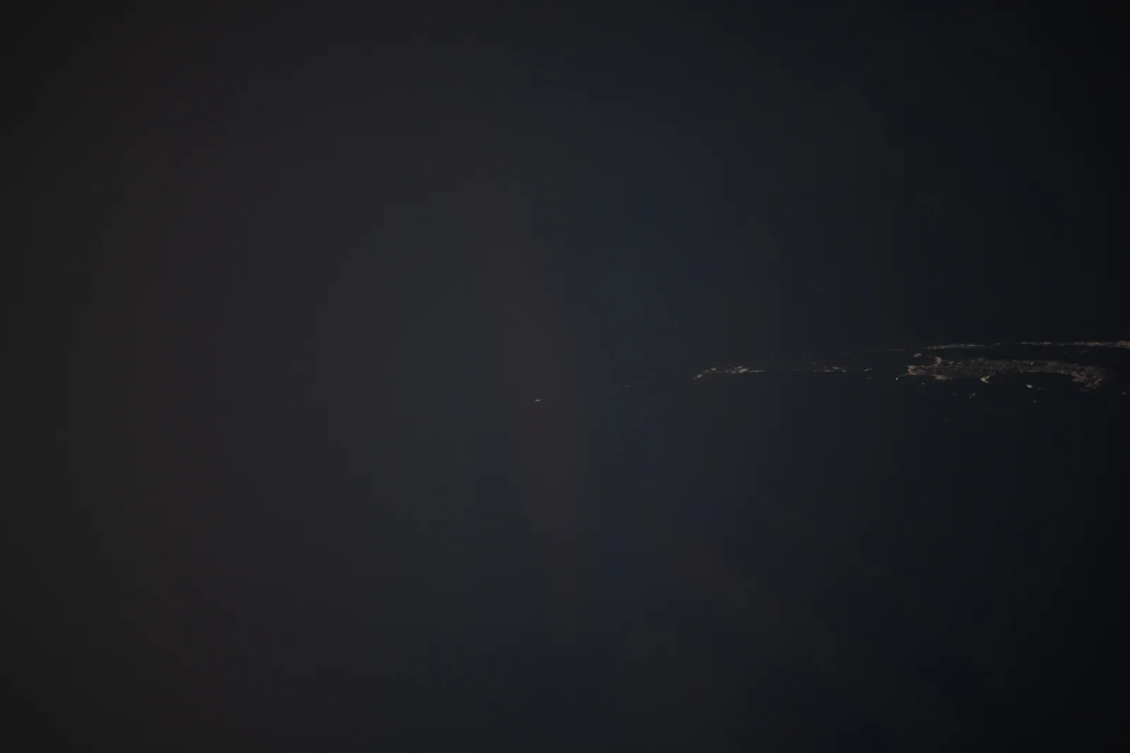 Artemis II photo ART002-E-24849: Earthset at 23:12 UTC: Earth sinking behind the Moon