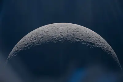 Artemis II photo ART002-E-12598: Earthset at 22:59 UTC: Earth sinking behind the Moon