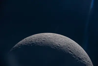 Artemis II photo ART002-E-12618: Earthset at 23:00 UTC: Earth sinking behind the Moon