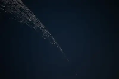 Artemis II photo ART002-E-12658: Earthset at 23:02 UTC: Earth sinking behind the Moon