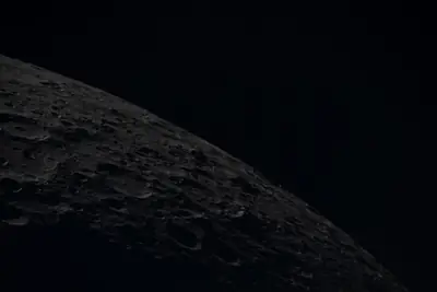 Artemis II photo ART002-E-12659: Earthset at 23:02 UTC: Earth sinking behind the Moon