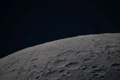 Artemis II photo ART002-E-12677: Earthset at 23:02 UTC: Earth sinking behind the Moon