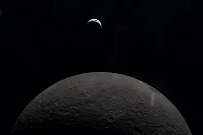 Artemis II photo ART002-E-19190: Earthset at 22:30 UTC: Earth sinking behind the Moon