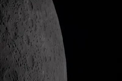 Artemis II photo ART002-E-20851: Earthset at 22:32 UTC: Earth sinking behind the Moon