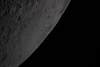 Artemis II photo ART002-E-20878: Earthset at 22:32 UTC: Earth sinking behind the Moon