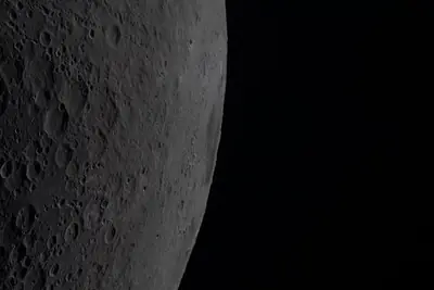 Artemis II photo ART002-E-20917: Earthset at 22:34 UTC: Earth sinking behind the Moon