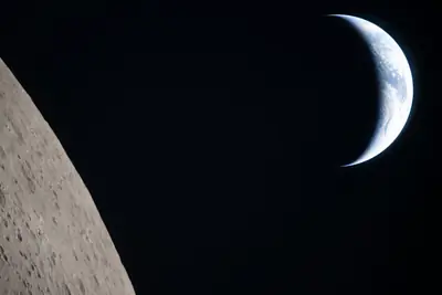 Artemis II photo ART002-E-20927: Earthset at 22:35 UTC: Earth sinking behind the Moon