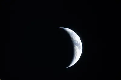Artemis II photo ART002-E-20950: Earthset at 22:36 UTC: Earth sinking behind the Moon