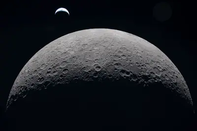 Artemis II photo ART002-E-20991: Earthset at 22:36 UTC: Earth sinking behind the Moon