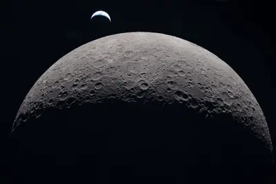 Artemis II photo ART002-E-21051: Earthset at 22:38 UTC: Earth sinking behind the Moon