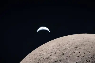 Artemis II photo ART002-E-21061: Earthset at 22:39 UTC: Earth sinking behind the Moon