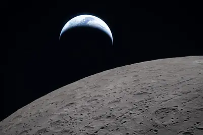 Artemis II photo ART002-E-21080: Earthset at 22:39 UTC: Earth sinking behind the Moon