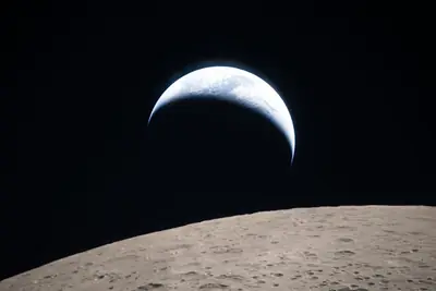 Artemis II photo ART002-E-21091: Earthset at 22:39 UTC: Earth sinking behind the Moon