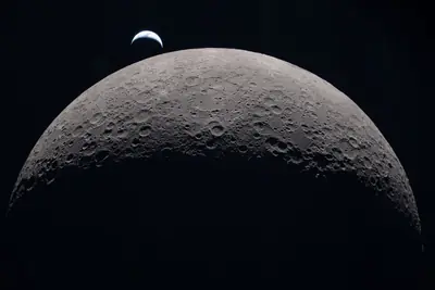 Artemis II photo ART002-E-21101: Earthset at 22:40 UTC: Earth sinking behind the Moon