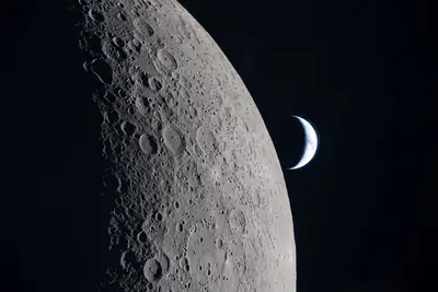 Artemis II photo ART002-E-21106: Role reversal: a crescent Earth hangs beyond the Moon