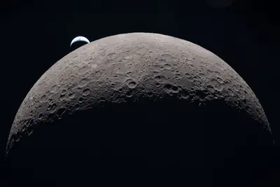 Artemis II photo ART002-E-21184: Earthset at 22:41 UTC: Earth sinking behind the Moon