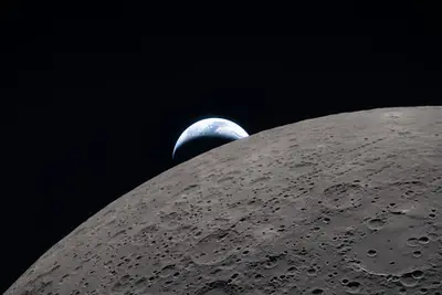 Artemis II photo ART002-E-21217: Earthset at 22:41 UTC: Earth sinking behind the Moon