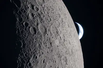 Artemis II photo ART002-E-21227: Earthset at 22:42 UTC: Earth sinking behind the Moon