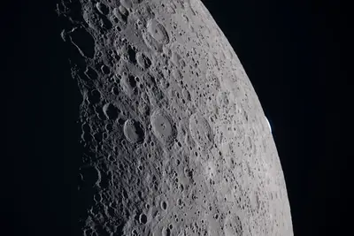 Artemis II photo ART002-E-21307: Earthset at 22:43 UTC: Earth sinking behind the Moon