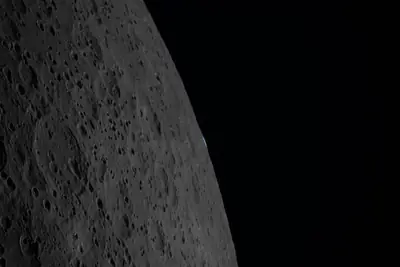 Artemis II photo ART002-E-21308: Earthset at 22:43 UTC: Earth sinking behind the Moon