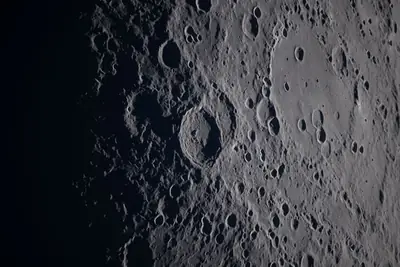 Artemis II photo ART002-E-21322: Earthset at 22:51 UTC: Earth sinking behind the Moon