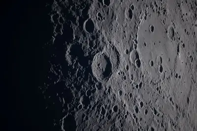 Artemis II photo ART002-E-21337: Earthset at 22:52 UTC: Earth sinking behind the Moon