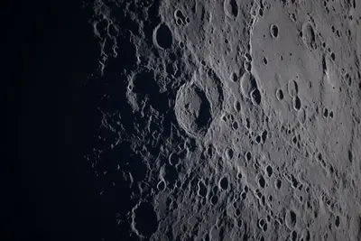 Artemis II photo ART002-E-21347: Earthset at 22:54 UTC: Earth sinking behind the Moon