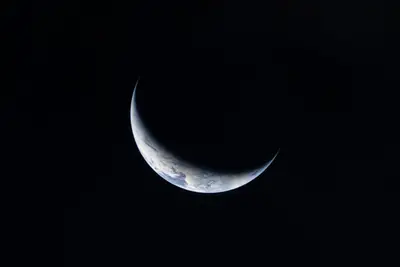 Artemis II photo ART002-E-23820: Earth from 204,073 km, on the way to the Moon