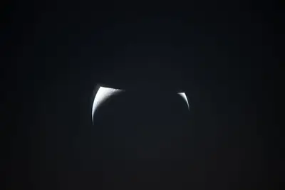 Artemis II photo ART002-E-24939: Earthset at 23:22 UTC: Earth sinking behind the Moon