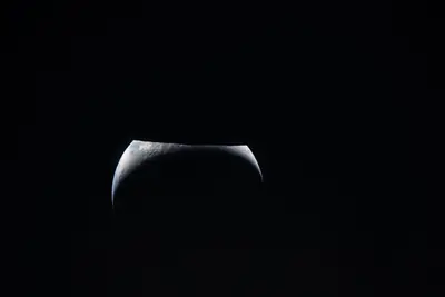 Artemis II photo ART002-E-24980: Earthset at 23:22 UTC: Earth sinking behind the Moon